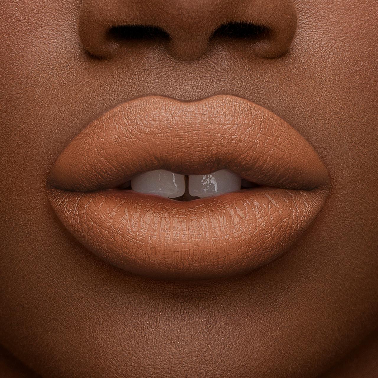 Close-up of lips wearing Artist Couture Silk Cream Lipstick in a smooth nude shade