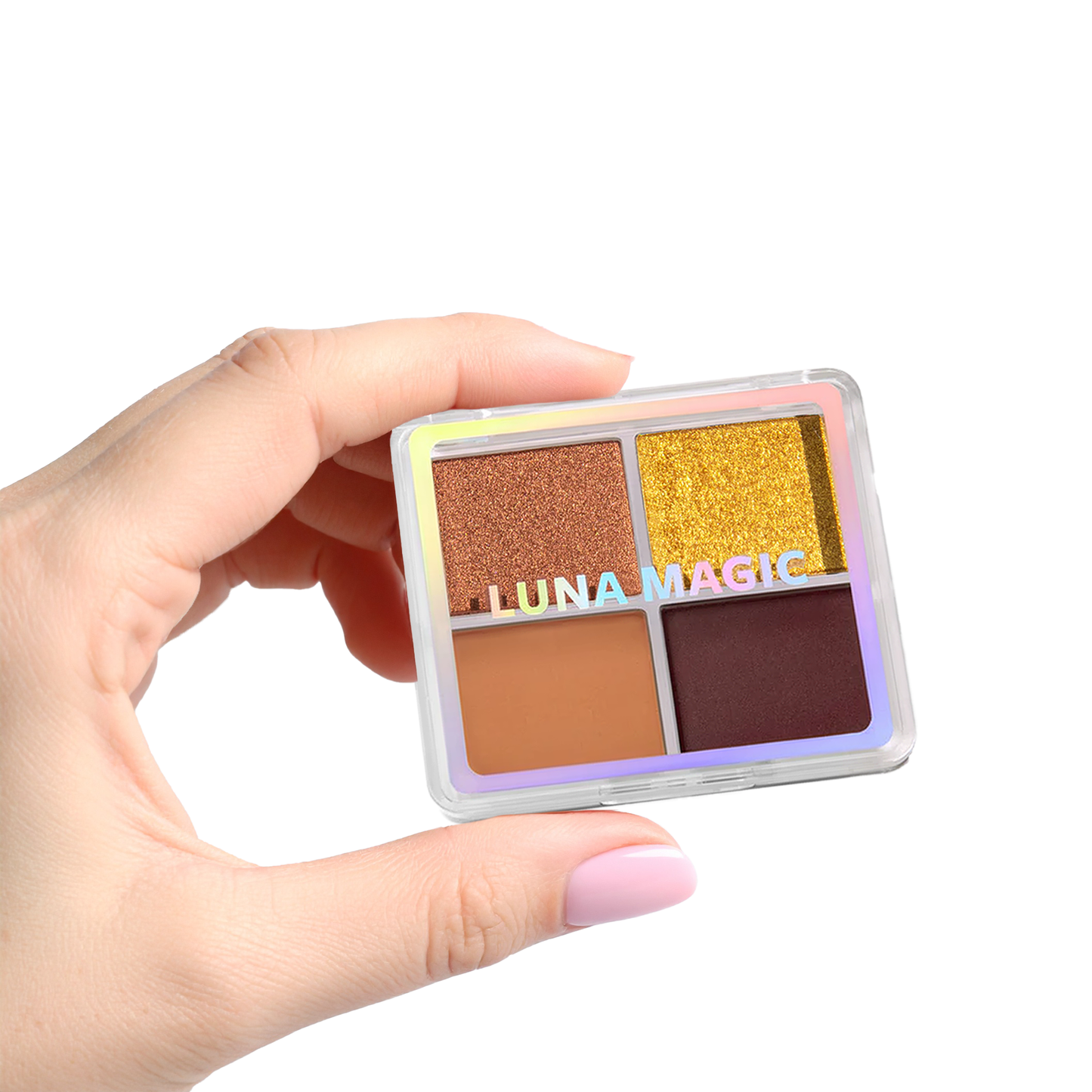 Hand holding Luna Magic Desert Heat Eyeshadow Quad with four warm shades in clear compact