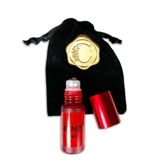 Innovate the Label Beauty Bundles luxury perfume oil rollerball in red bottle with black velvet pouch