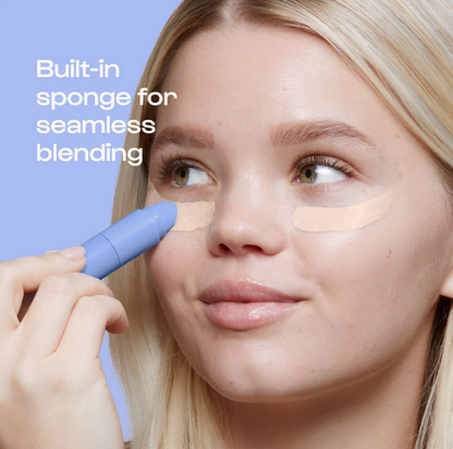 Woman applying Alleyoop Game Face Concealer with built-in sponge for seamless blending under eyes