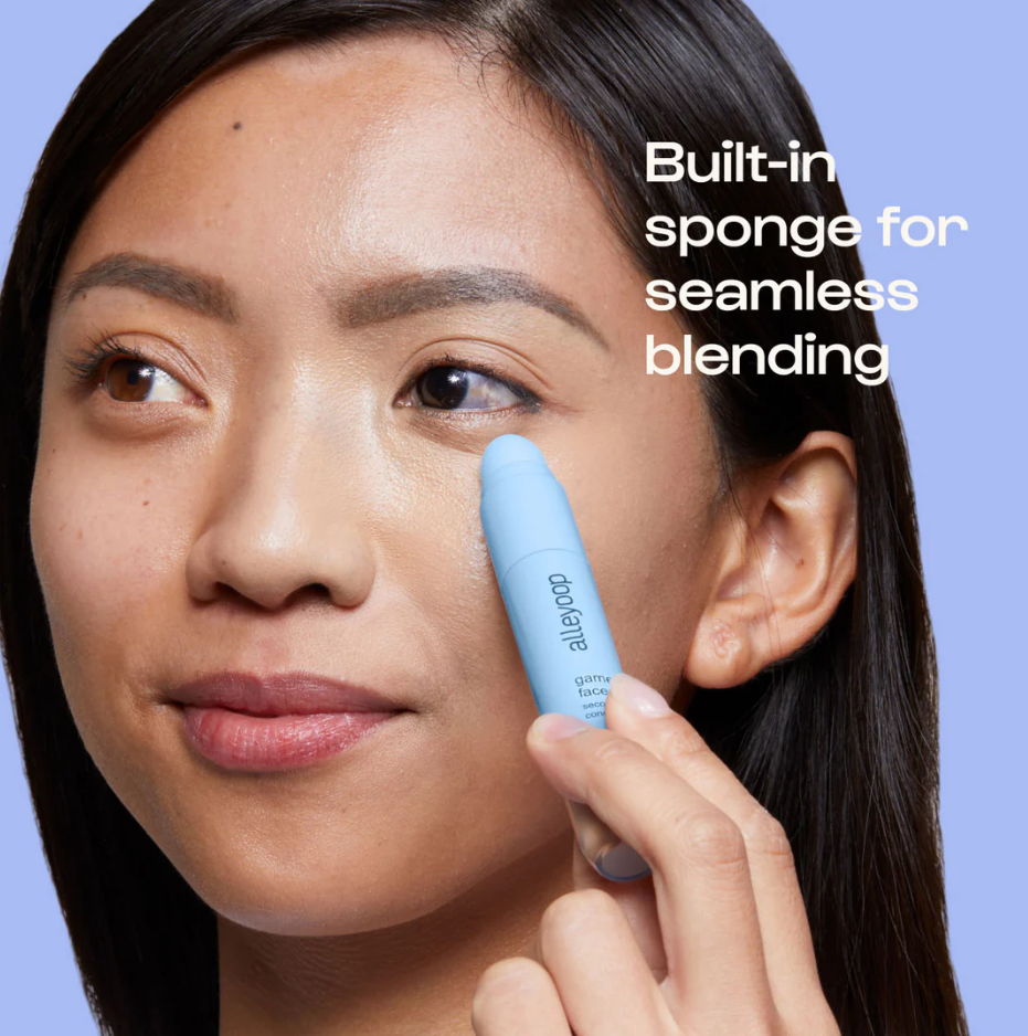 Woman applying Alleyoop Game Face Concealer with built-in sponge for seamless blending