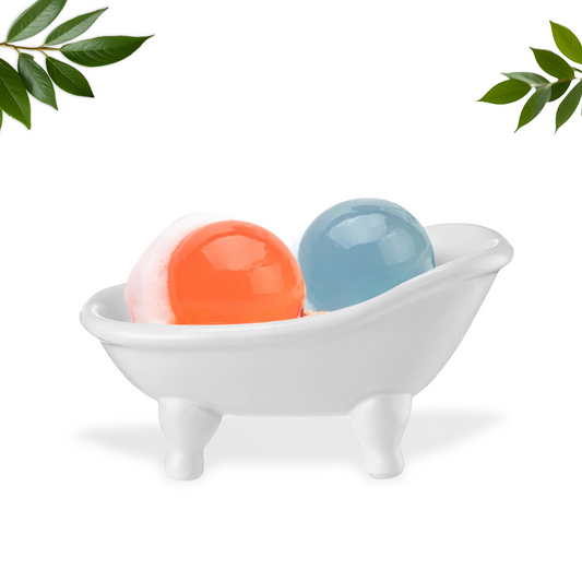 Naisture aqua jelly ball cleanser duo in orange and blue displayed in small white bathtub dish