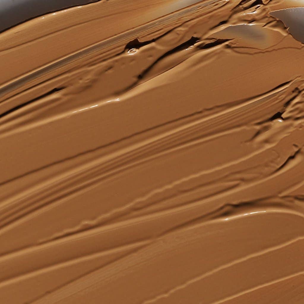 Close-up of smooth texture of cream bronzer for face in rich brown shade by Innovate the Label
