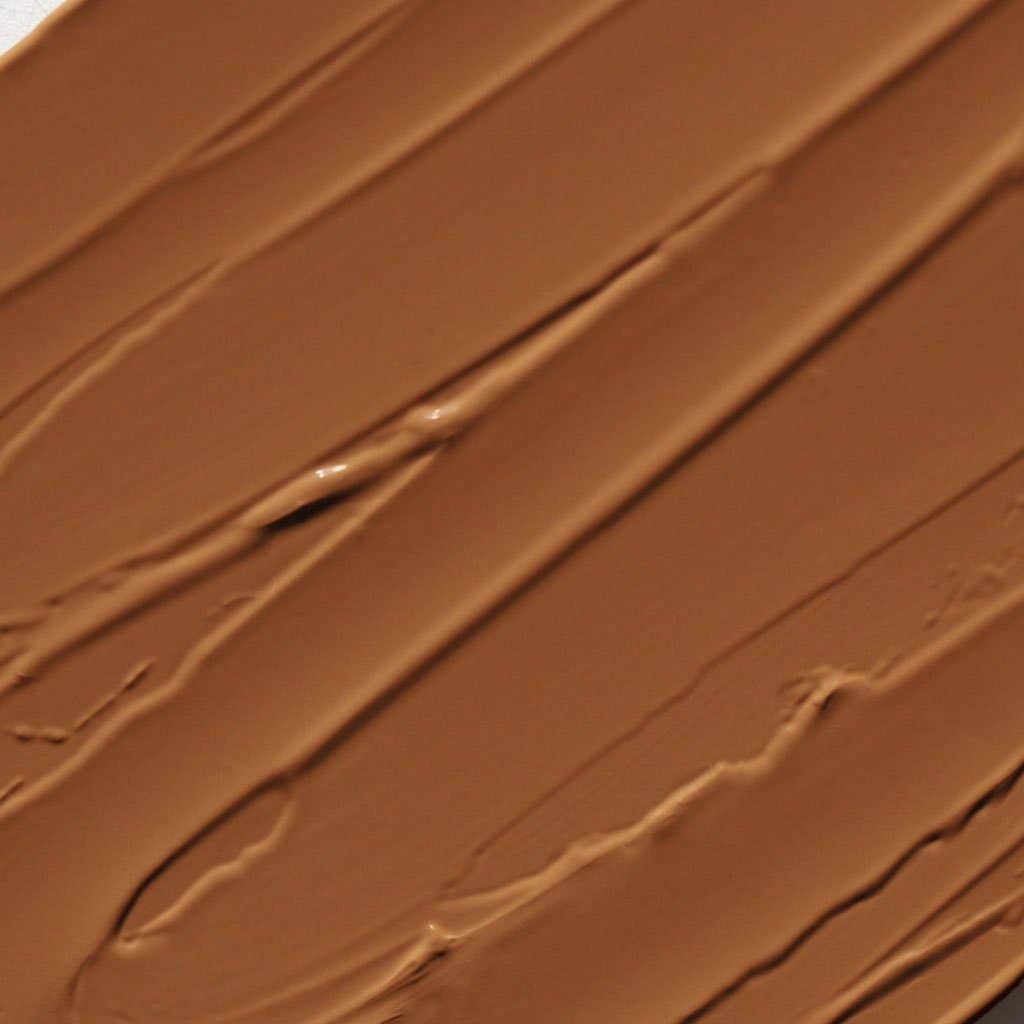 Smooth texture of cream bronzer for face in a warm brown shade by Innovate the Label