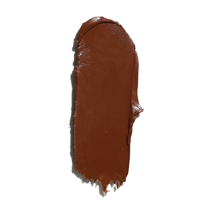 Rich brown cream bronzer for face swatch with smooth creamy texture on white background