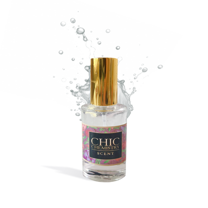 Chic Chemistry Eau de Parfum perfume oil bottle with gold cap and water splash background