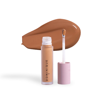 Dominique Cosmetics concealer by Innovate the Label in a beige shade with applicator wand and color swatch