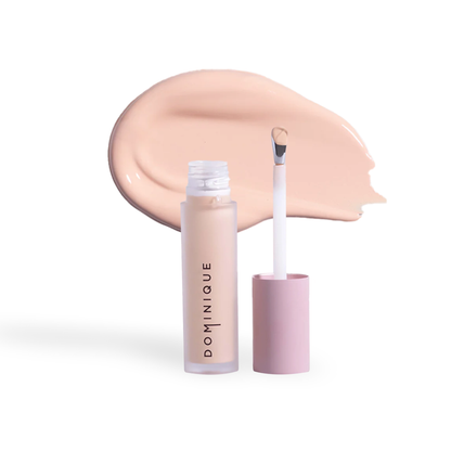 Dominique Cosmetics concealer by Innovate the Label with applicator and creamy beige shade smear