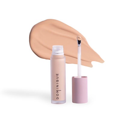 Dominique Cosmetics concealer by Innovate the Label with applicator wand and creamy beige shade swatch