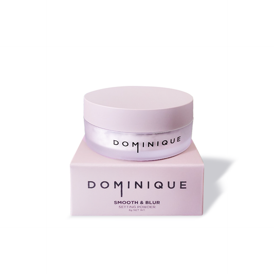 Dominique Cosmetics setting powder in pink container with matching box for smooth and blur finish