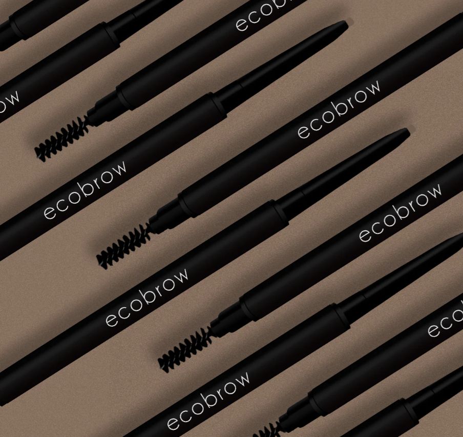 Light brown eyebrow pencil by Innovate the Label with spoolie brush and retractable tip in black casing