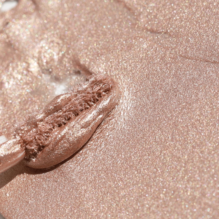Close-up of shimmering rose gold liquid eyeshadow with applicator Half Caked Night Show Liquid Shadow