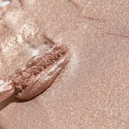 Close-up of shimmering rose gold liquid eyeshadow with applicator Half Caked Night Show Liquid Shadow