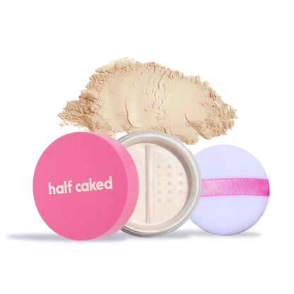 Innovate the Label translucent setting powder for makeup in clear jar with pink lid and powder puff