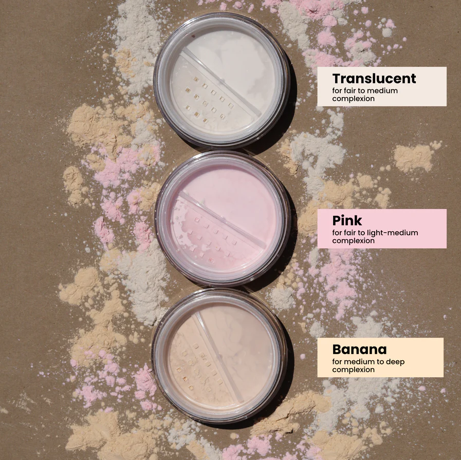 Innovate the Label translucent setting powder for makeup shown in three shades with powder spilled around