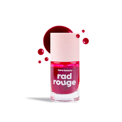 Kara Beauty Rad Rouge Lip Tint in vibrant berry red bottle with white cap and splash droplets