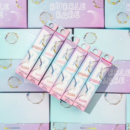 Kara Beauty Bubble Babe strawberry gloss stick boxed pastel packaging arranged on matching pastel bubble background