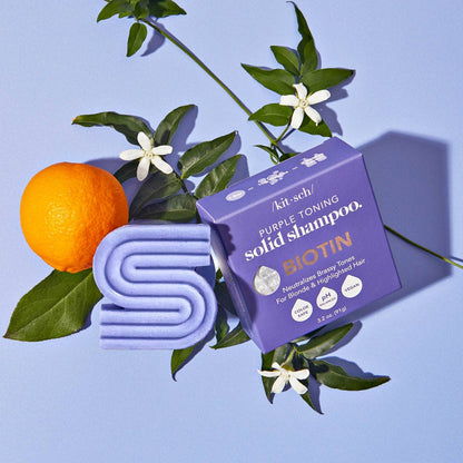 Innovate the Label purple shampoo bar for blonde hair with orange and green leaves on purple background