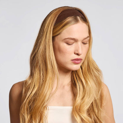 Blonde woman modeling a wide brown eco-friendly workout headbands by Innovate the Label soft stretch fabric