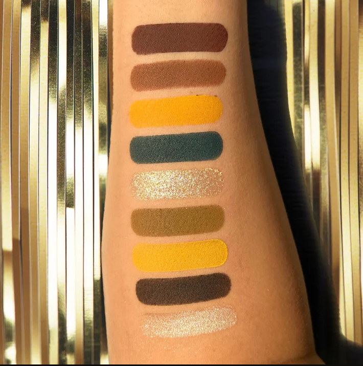 Swatches of Innovate the Label Carne Asada inspired eyeshadow palette showing warm and bold shades on arm