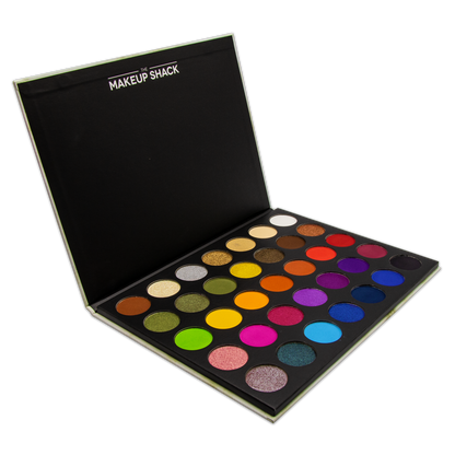 The Makeup Shack colorful eyeshadow palette featuring vibrant matte and shimmer shades in a sleek black case