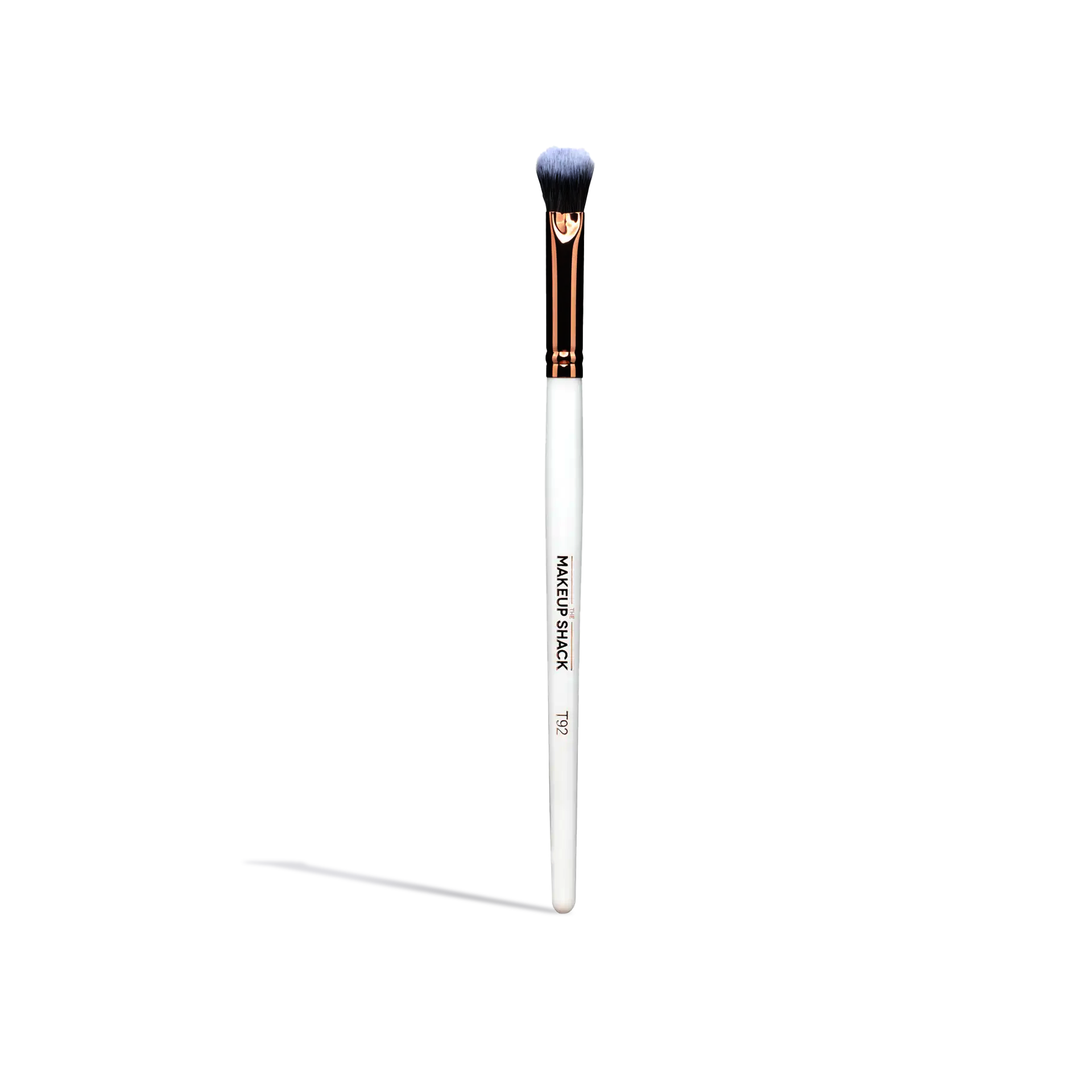 Single makeup brush from essential face brush set with white handle and soft bristles