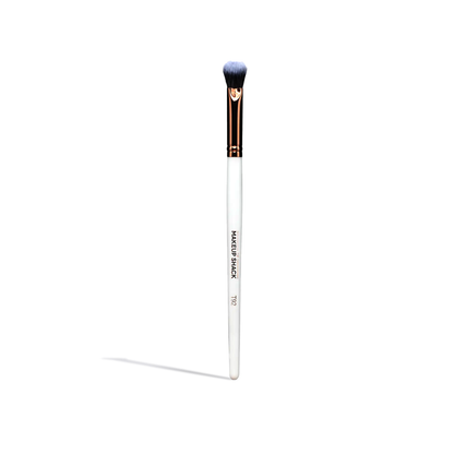 Single makeup brush from essential face brush set with white handle and soft bristles