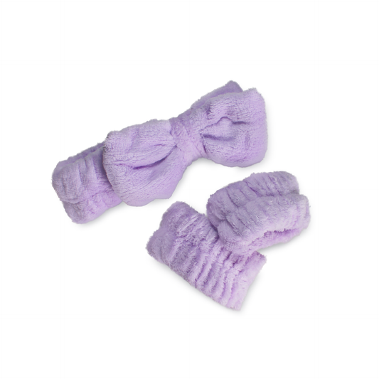 Purple spa headband and wristband set made of soft plush fabric for comfortable skincare routines