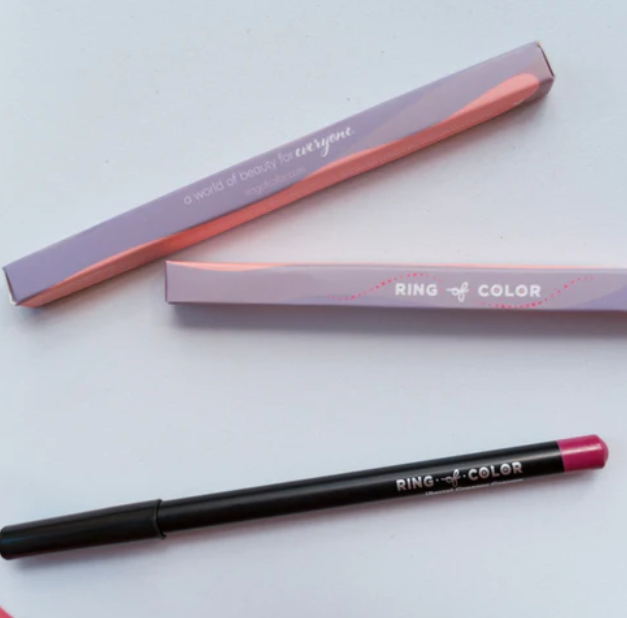 Creamy lip liner crayon by Innovate the Label Beauty Bundles in black casing with pink tip and purple packaging