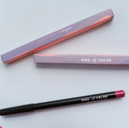 Creamy lip liner crayon by Innovate the Label Beauty Bundles in black casing with pink tip and purple packaging