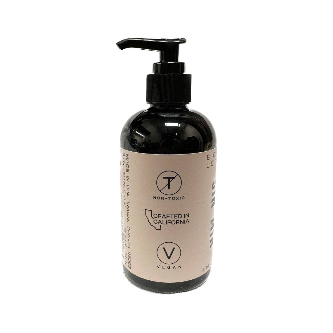 SIN-MIN sweet cinnamon vanilla body lotion in a black pump bottle with non-toxic and vegan labels