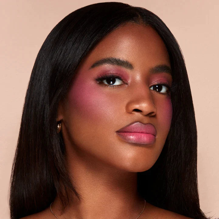 Model wearing Alamar liquid blush by Innovate the Label showing vibrant pink cheeks and smooth complexion
